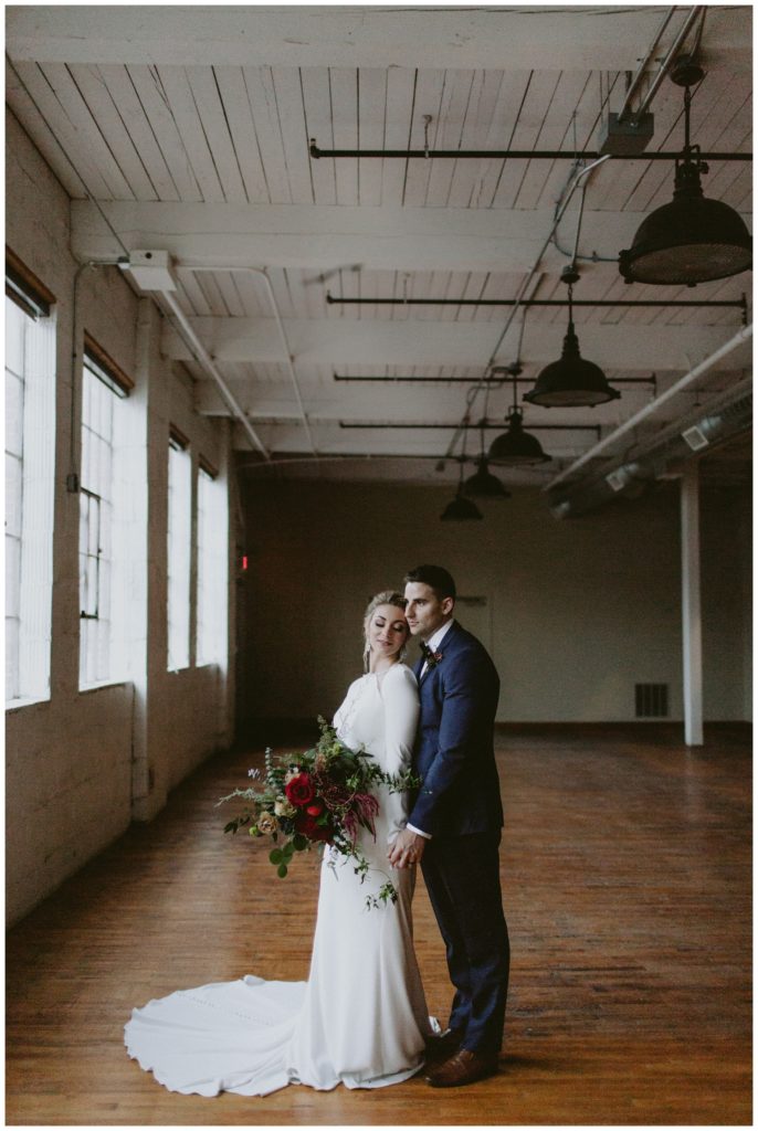intimate wedding portraits taken in industrial place