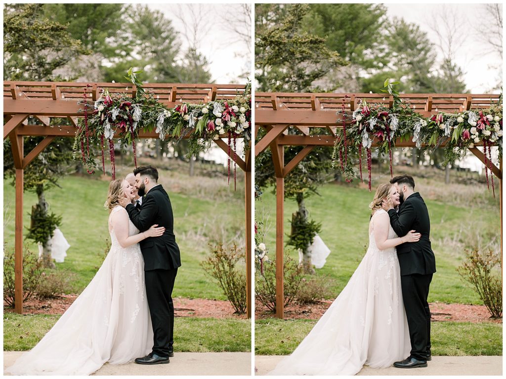 bride and grooms first kiss at wedding ceremony