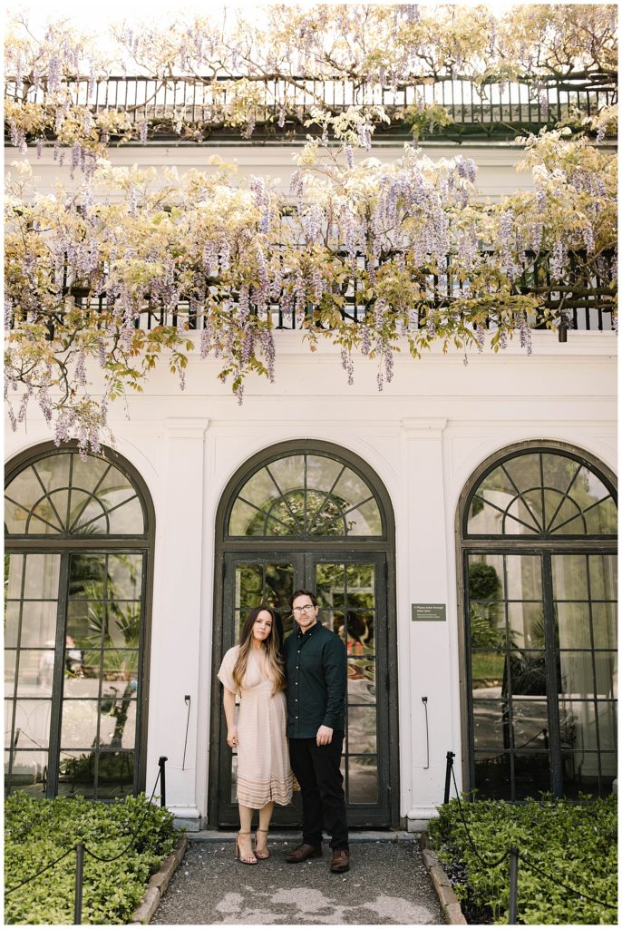 engagement photos in front of conestoga house at longwood gardens