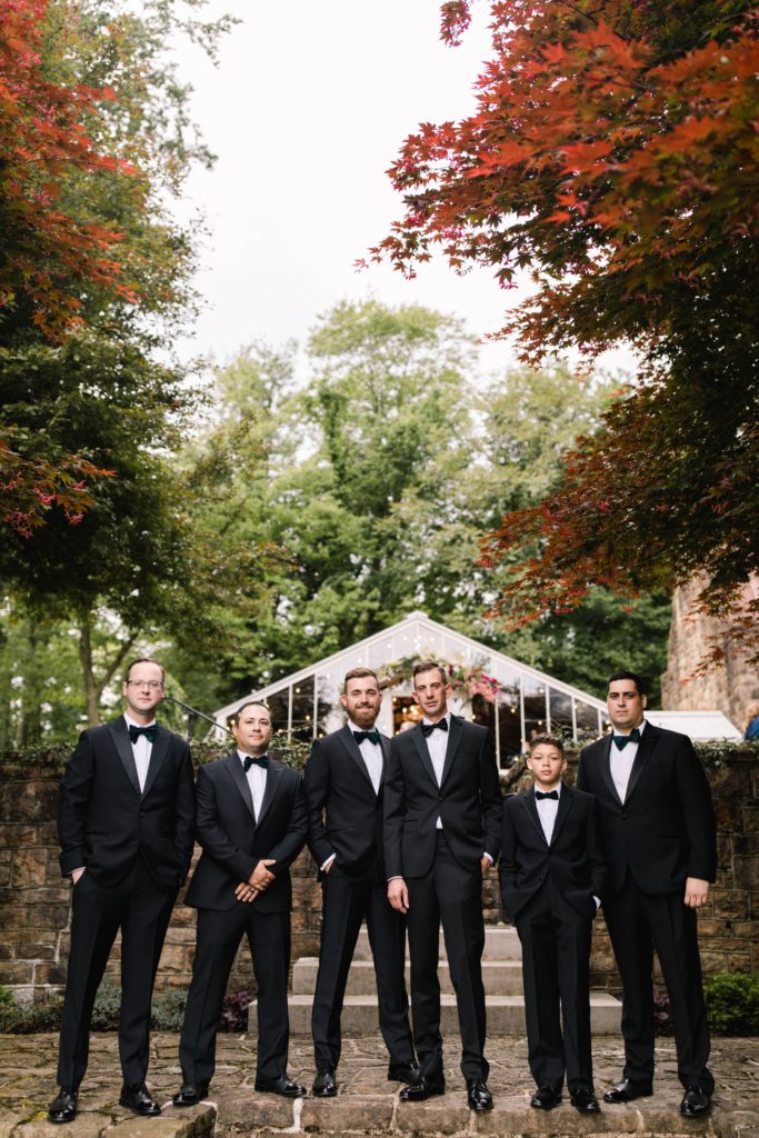 groomsmen laughing for photo s
