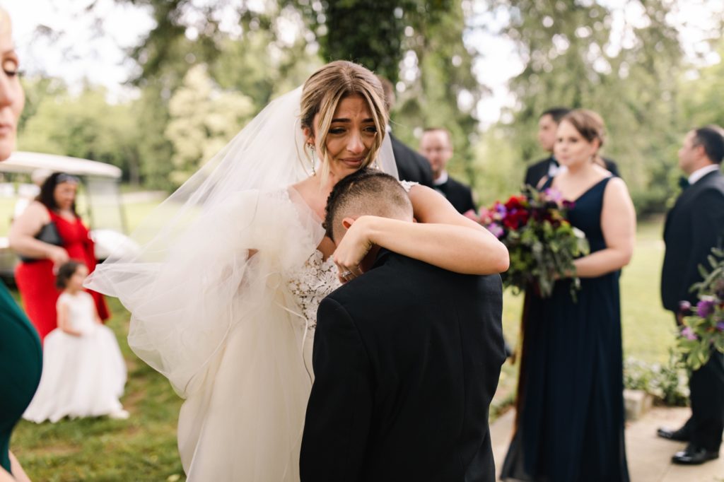 bride hugs brother and cries