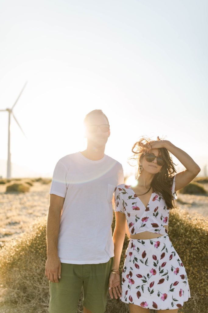 couple posing for engagement photos in desert in palm springs