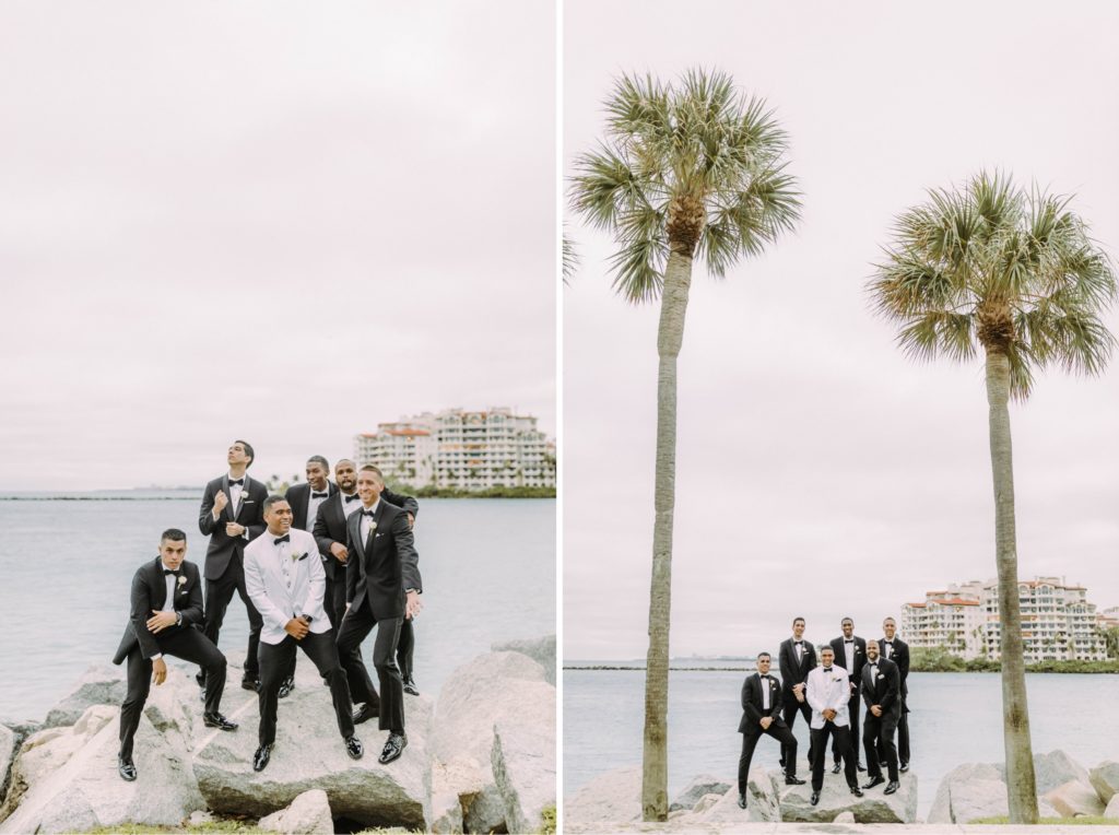 groomsmen standing on rocks