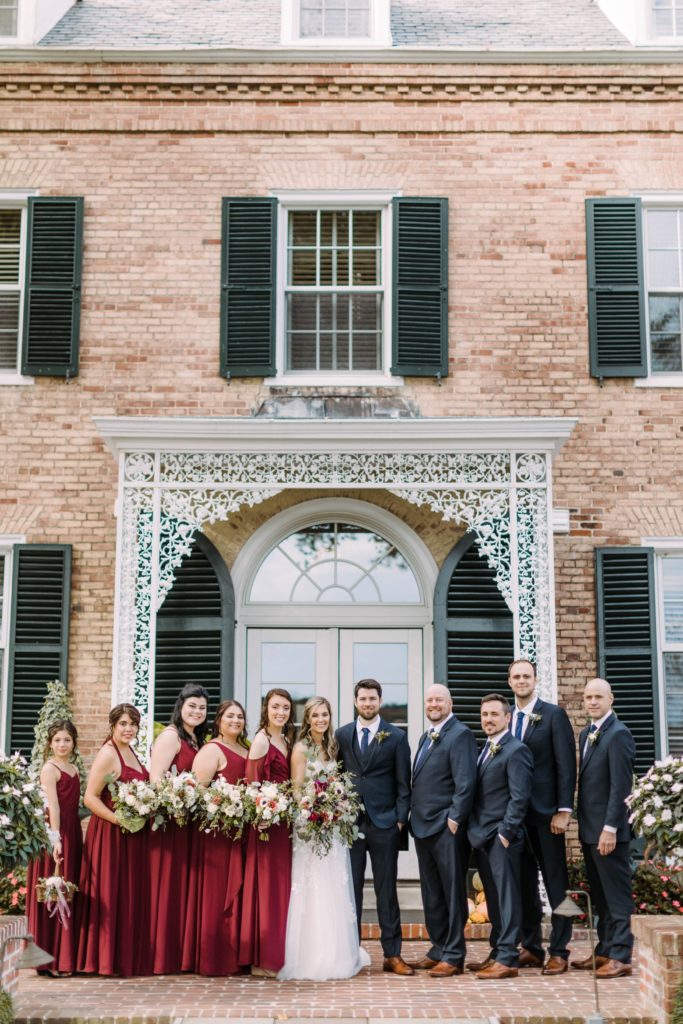 bridal party stand in front of drumore estate 