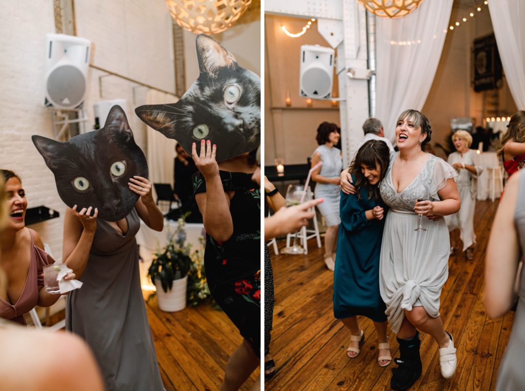 guests dance at wedding reception 