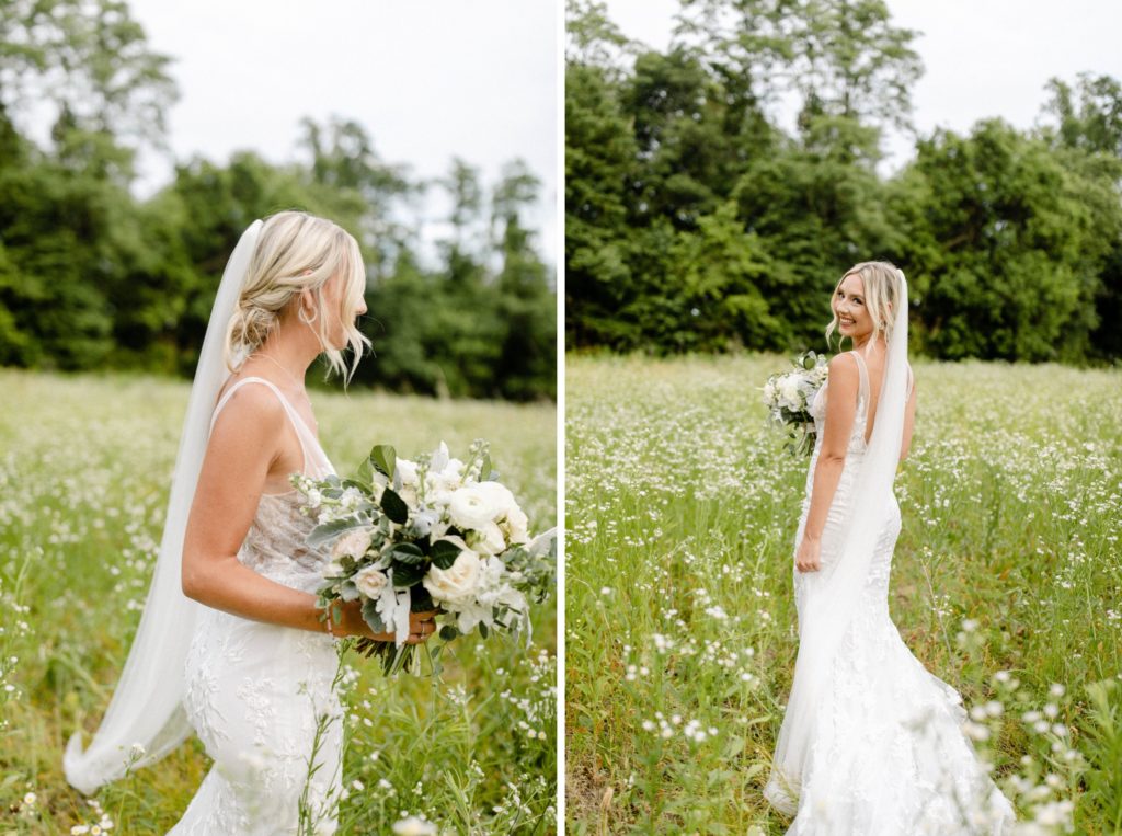 bride poses in flower field for wedding pictures