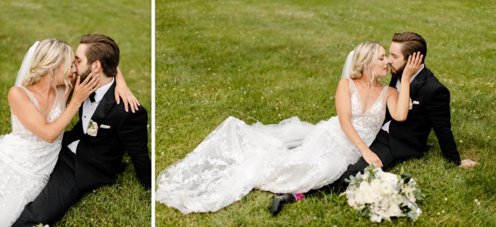 couple laying in grass for wedding pictures
