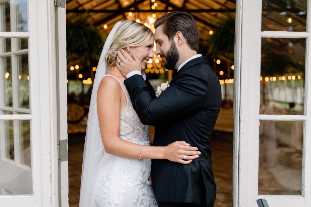 couple kiss for wedding photos at intimate wedding