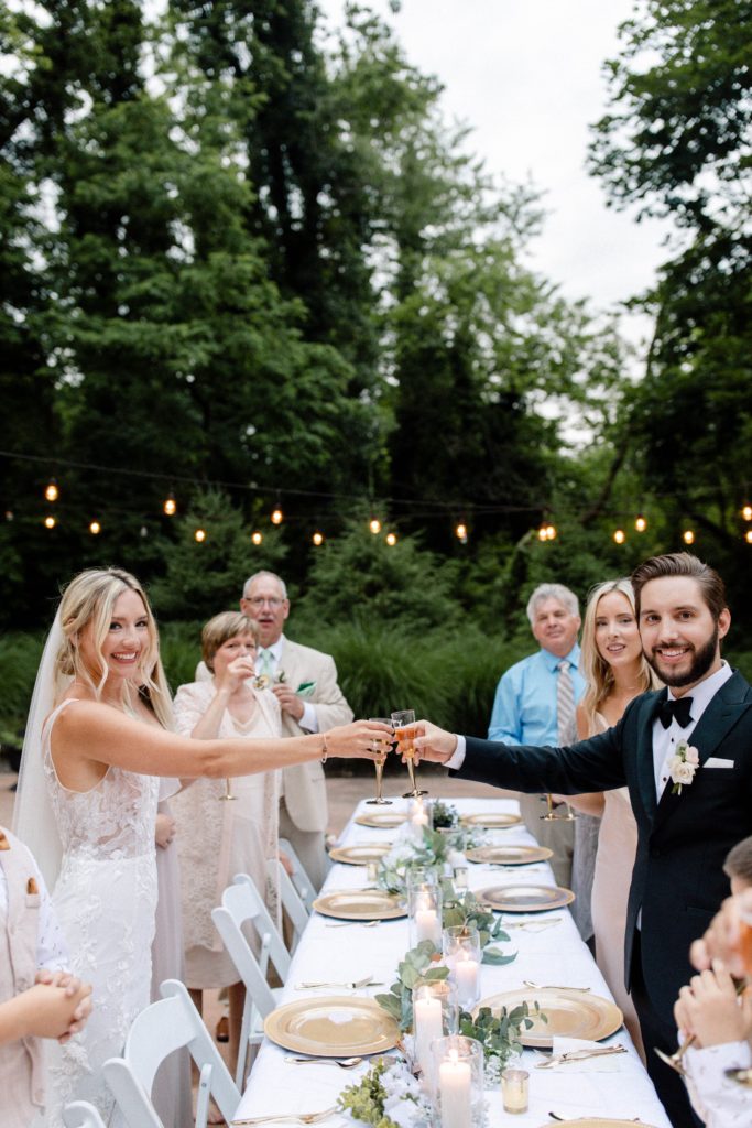 couple toasts at intimate wedding