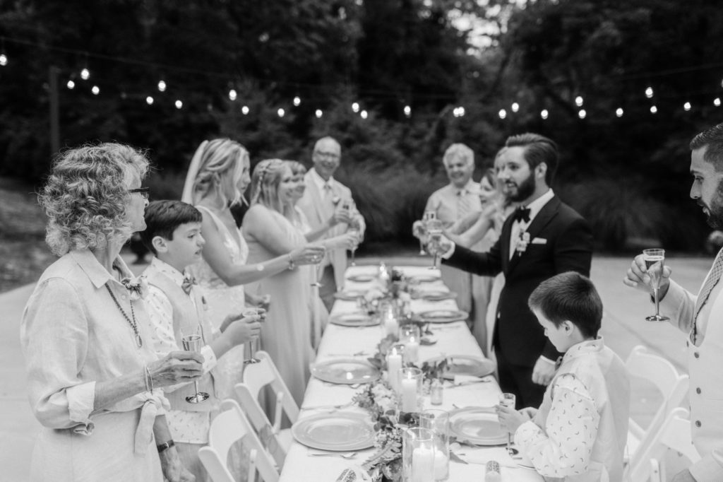 family toasting champagne at intimate wedding