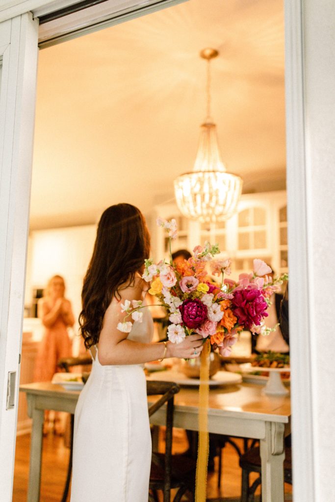 bride holding flowers at intimate wedding