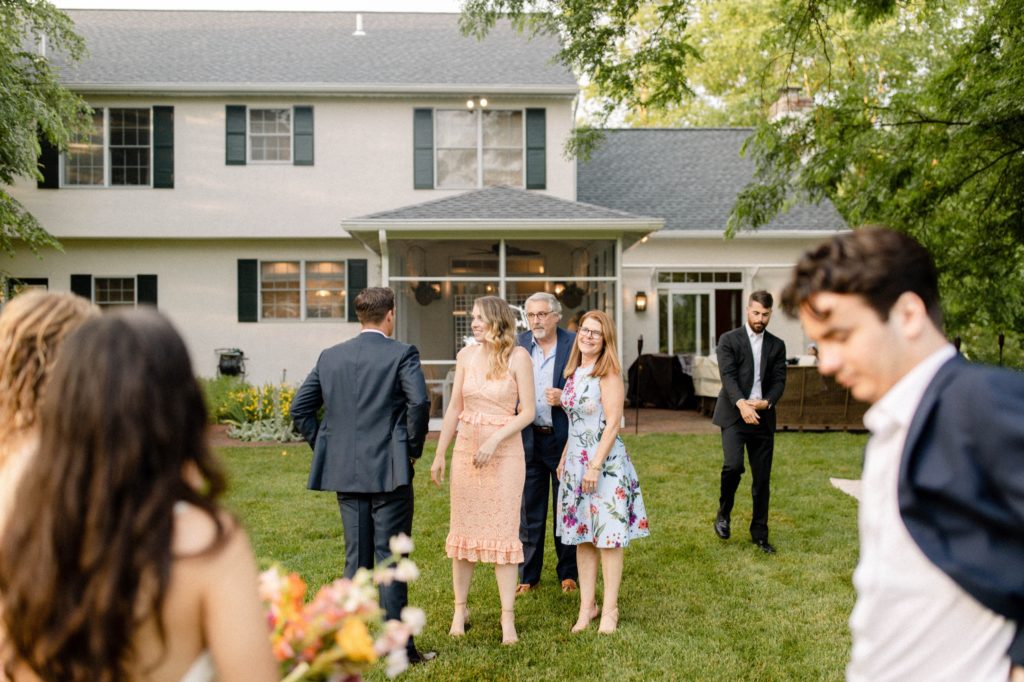 family in backyard for intimate wedding