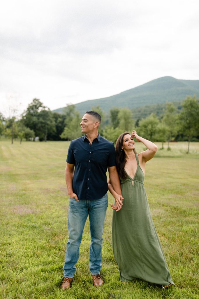 couple standing in flower field in woodstock