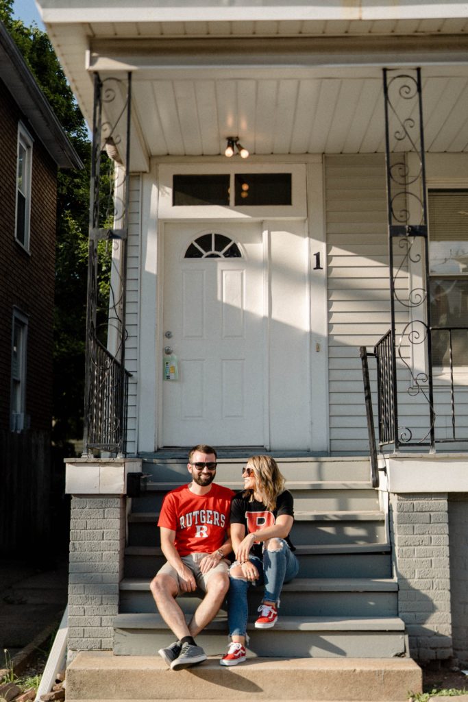 couple sitting on dorm steps on dorm at rutgers