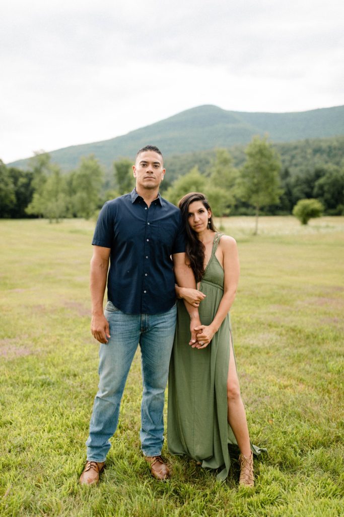 couple posing in front of mountain for woodstock engagement session
