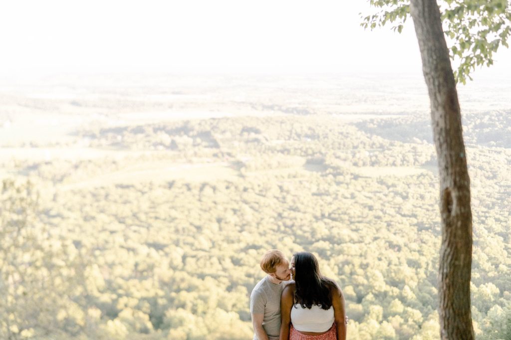 couple standing on overlook in weiser forest