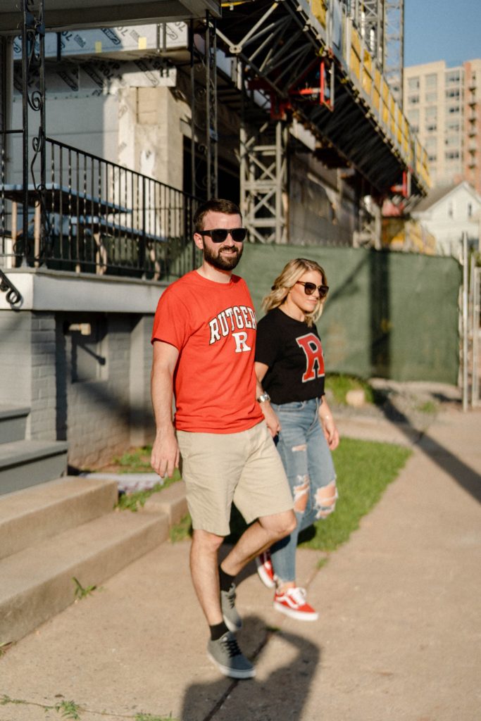 couple walking in rutgers for engagement session