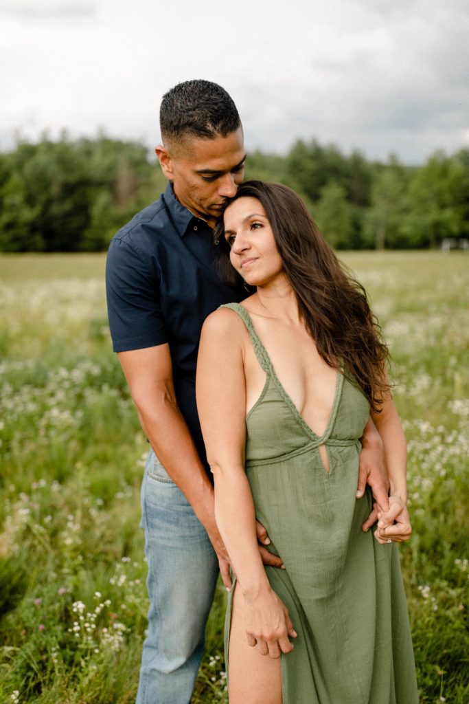 couple being cute in a field for woodstock engagement session