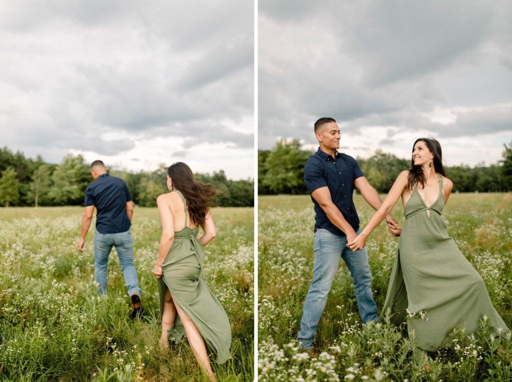 couple walking through flower field for woodstock engagement session