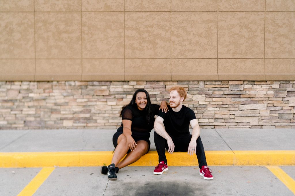 couple sitting on curb