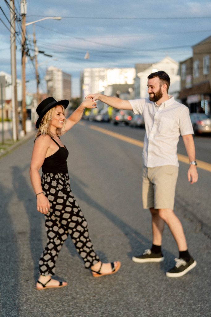 couple walking in street for rutgers engagement session
