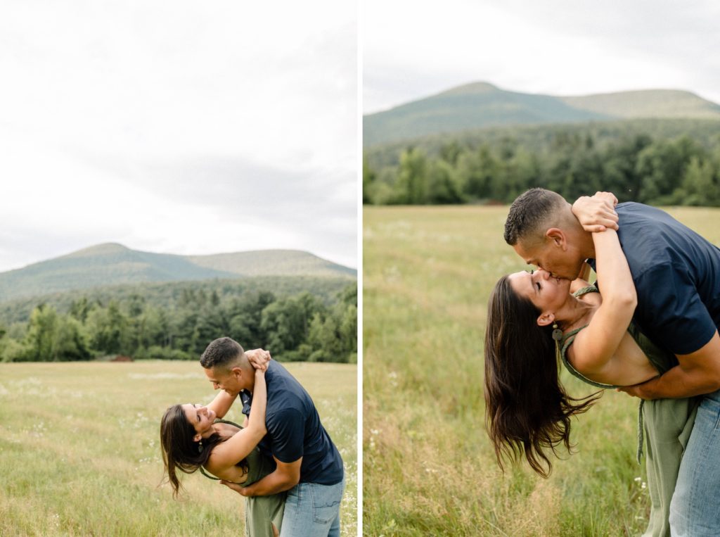 couple kissing in front of mountain for woodstock engagement session