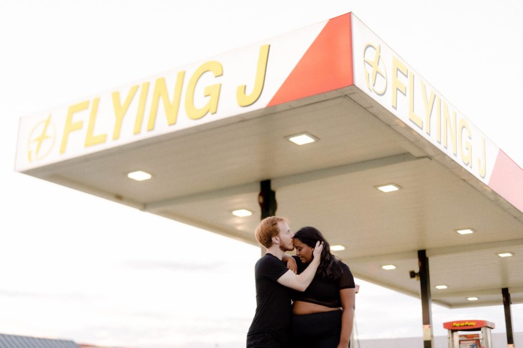 couple posing for photo session at truck stop