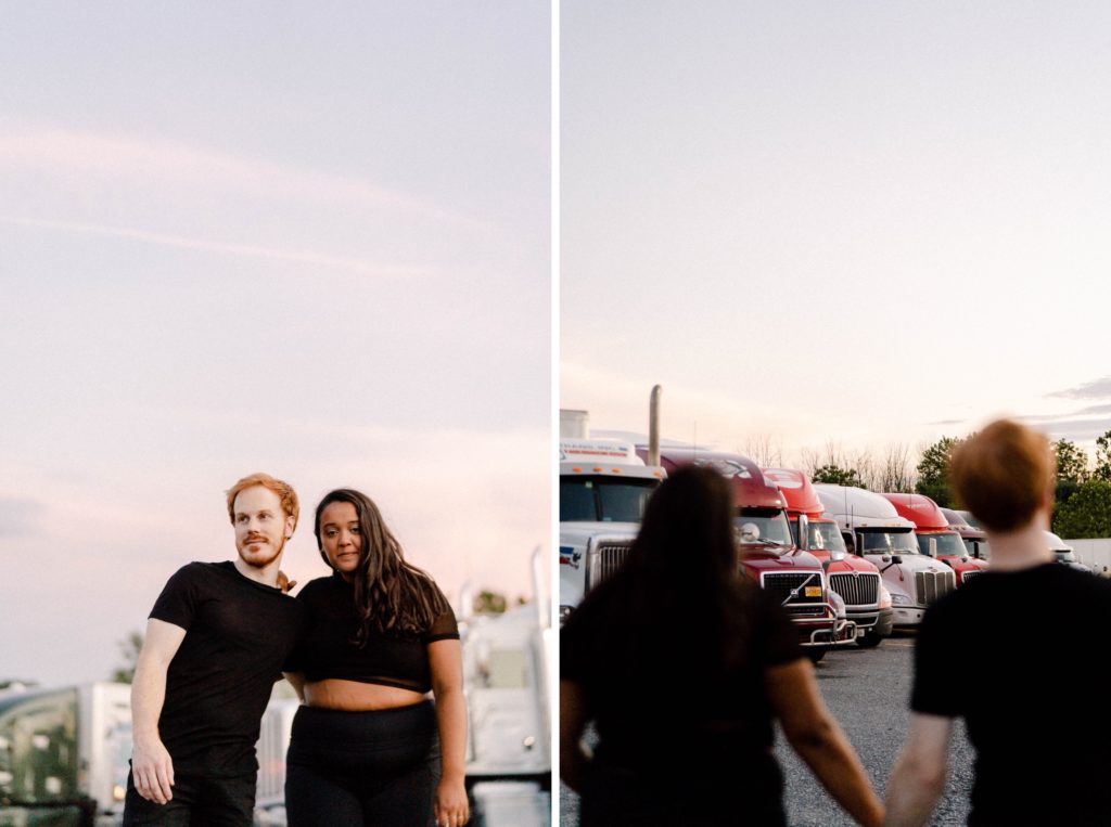 couple posing for photos at a truck stop