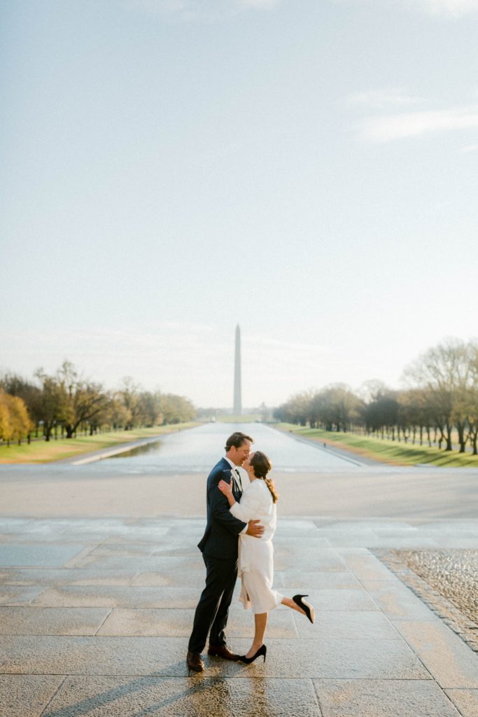 couple kissing in front of lincoln memorial