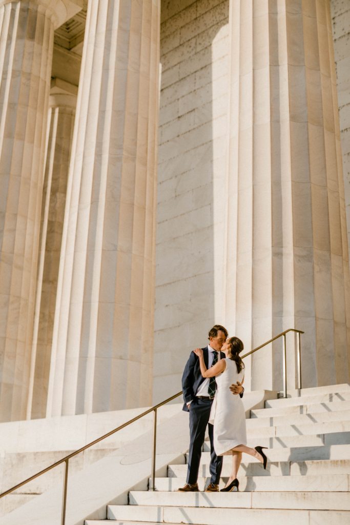couple standing on steps of lincoln memorial