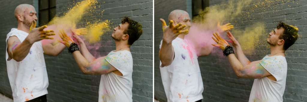 a couple throws holi powder at each other