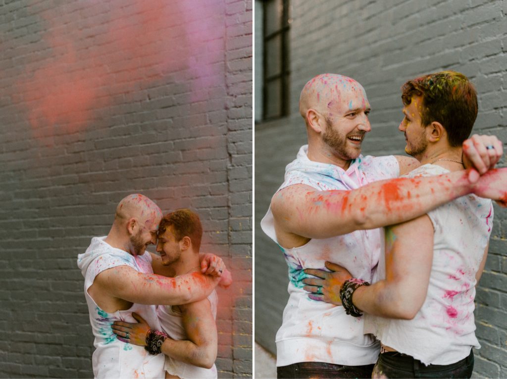 a couple kissing while covered in a smoke bomb