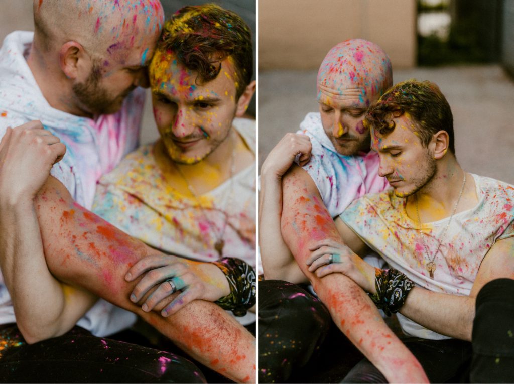 a couple huge closely while covered in paint