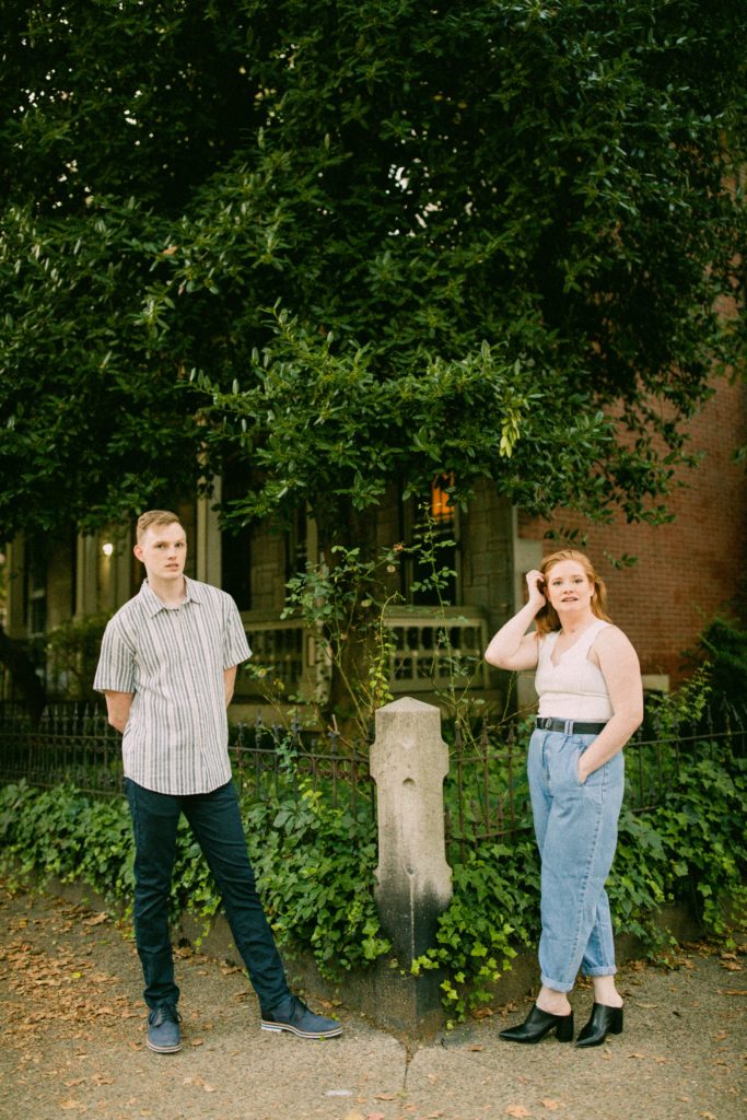 couple standing on corner posing for romantic philadelphia couples session