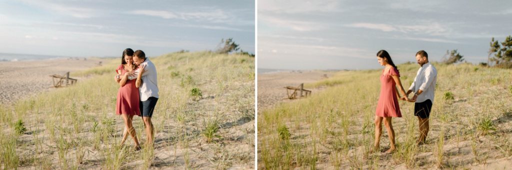 couple walking in sand dunes for sunrise rehoboth beach engagement session