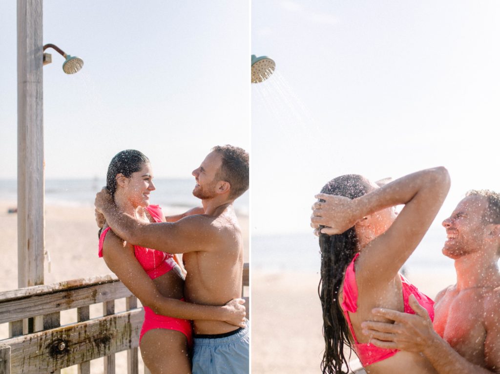 couple gets a beach shower for sunrise rehoboth beach engagement session