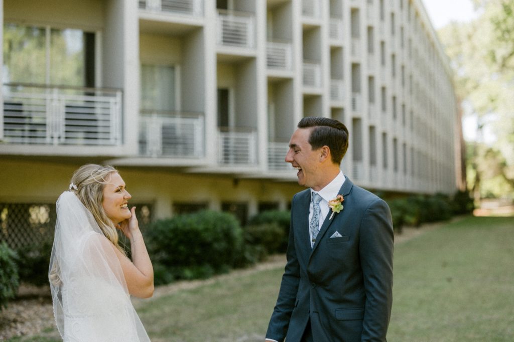 bride and groom laugh at wedding photos for hilton head beach wedding