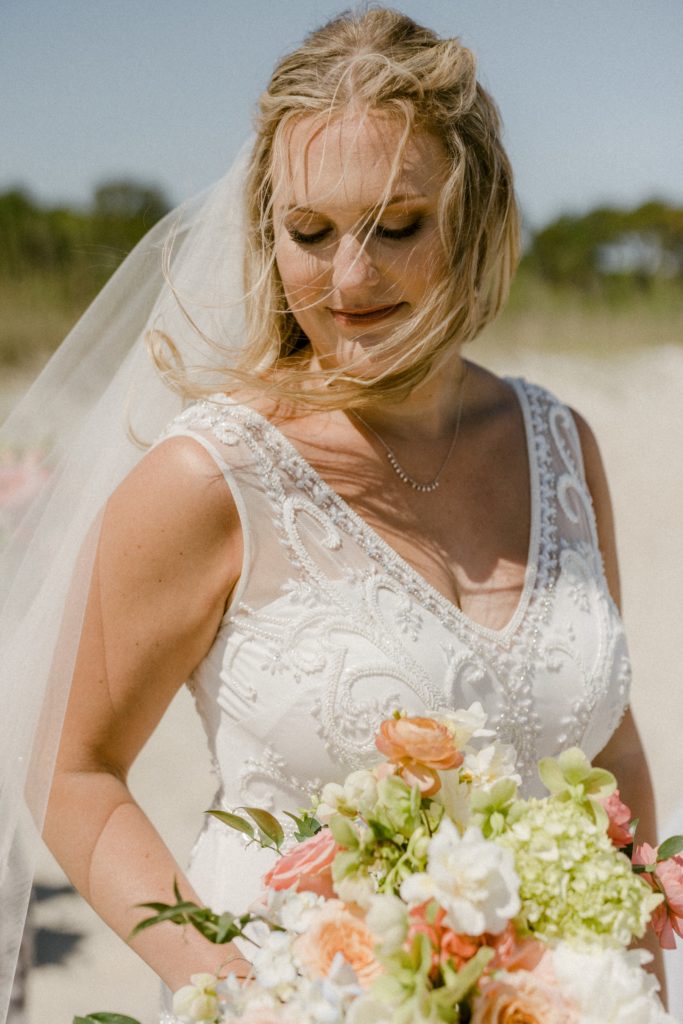 bride posing for beach wedding 