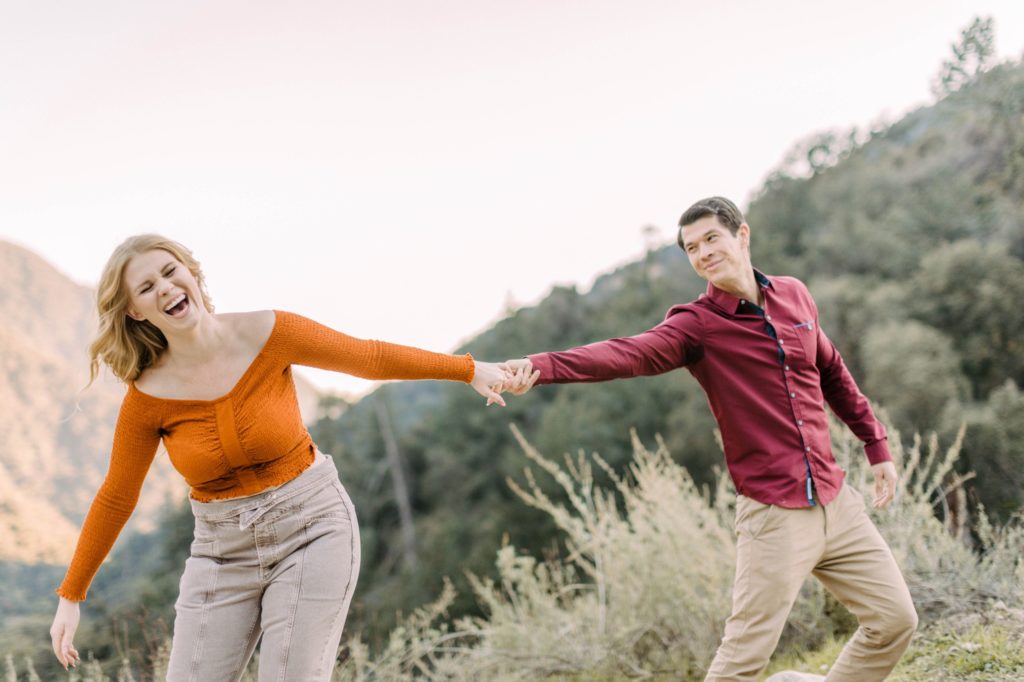couple playing for engagement photos in angeles national forest 