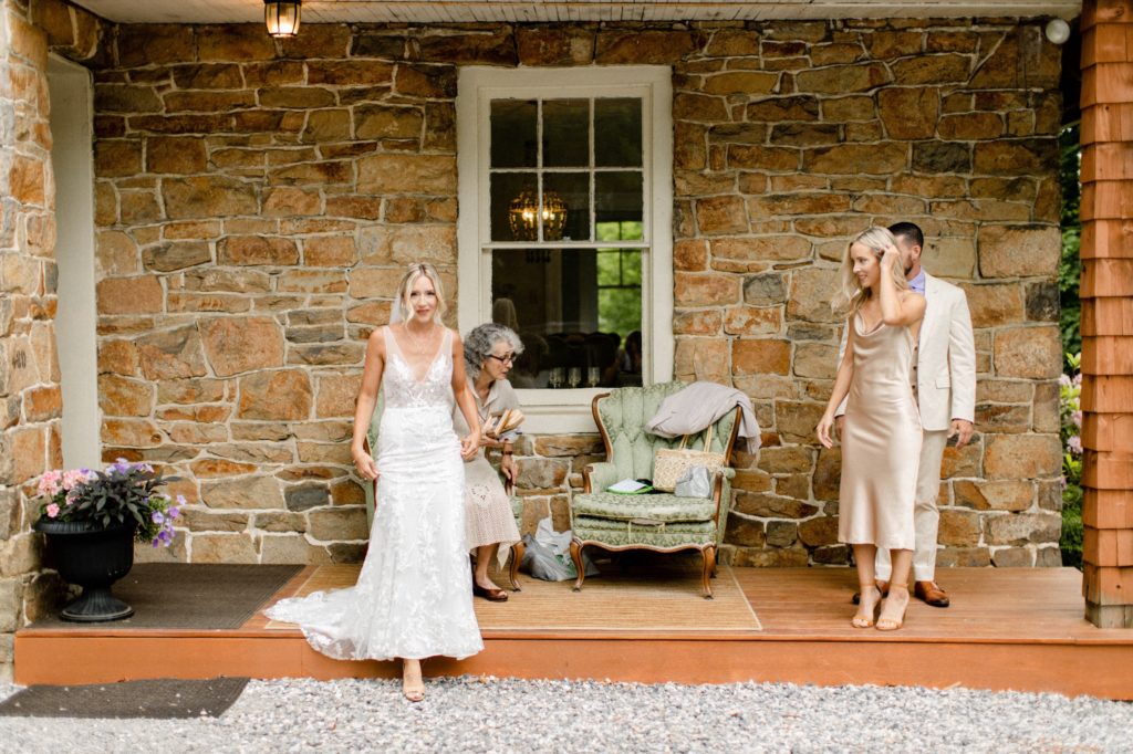 bride walking out of wedding cottage