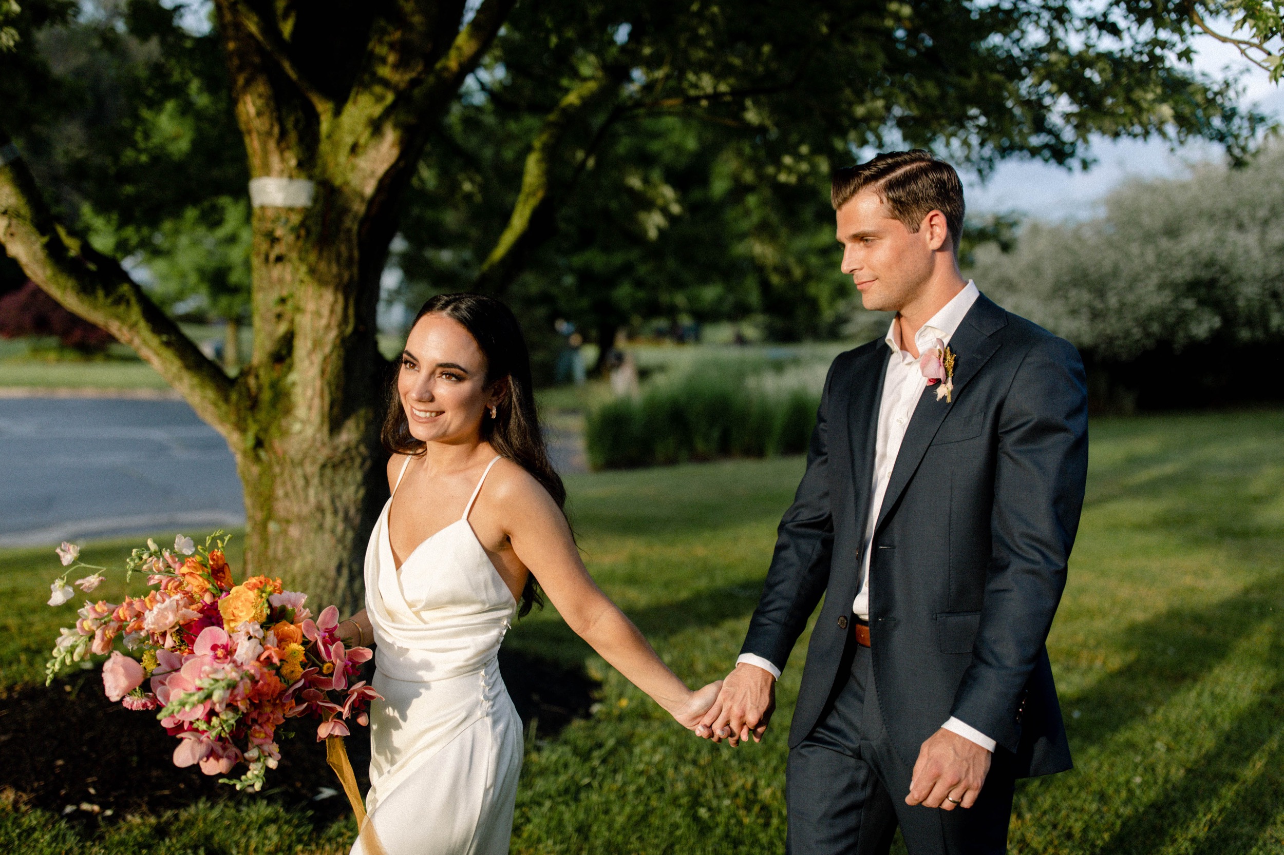 couple walking into sunset at intimate wedding