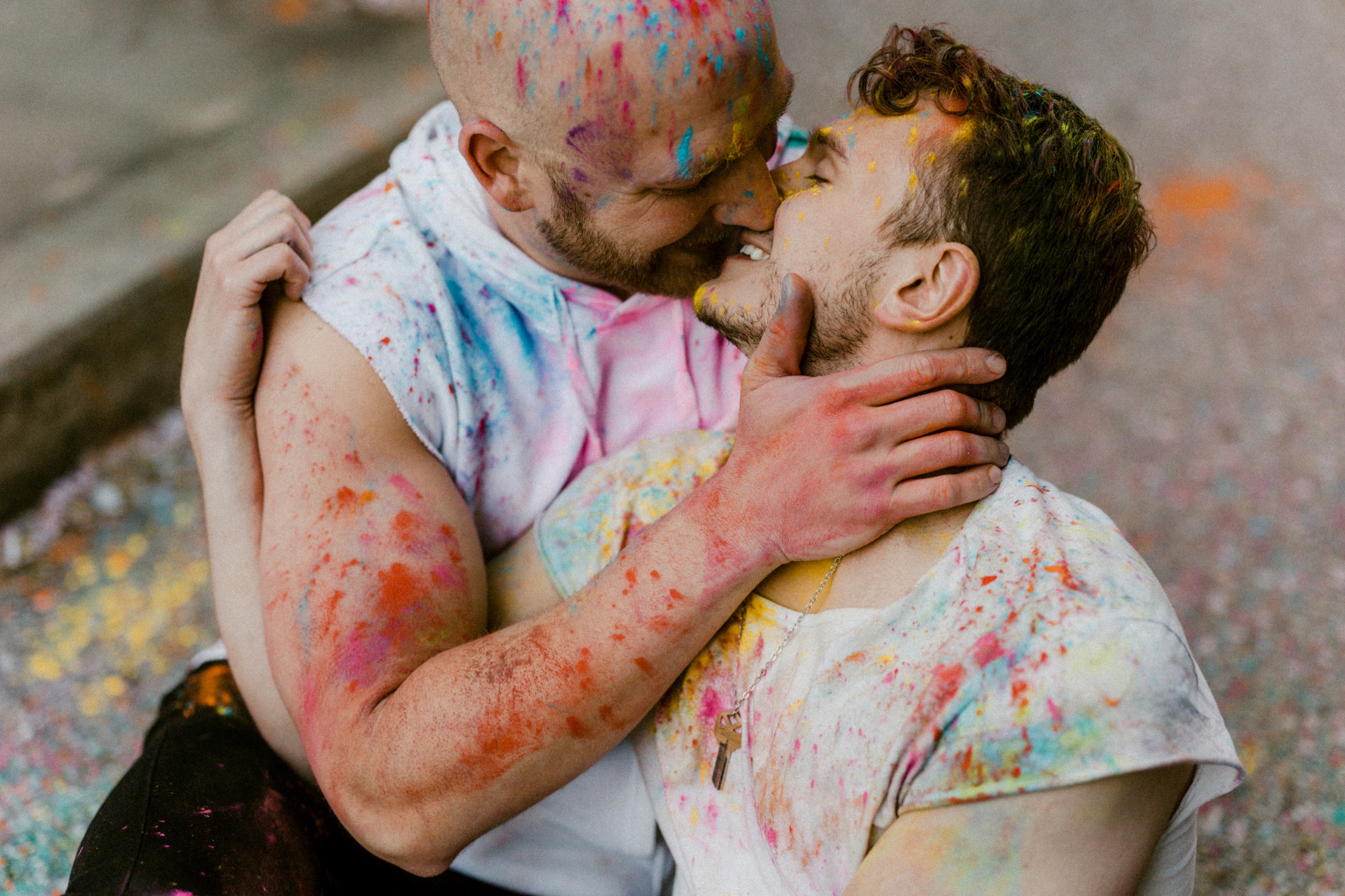 a couple kissing covered in paint