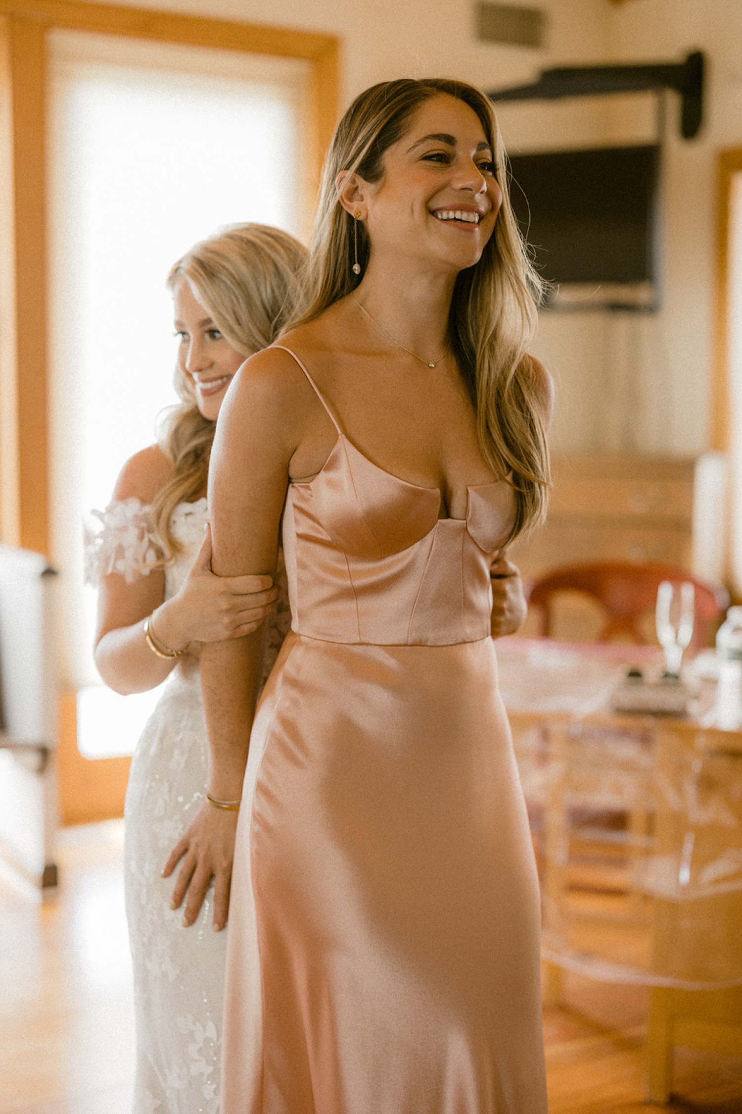 bride hiding before first look with bridesmaids