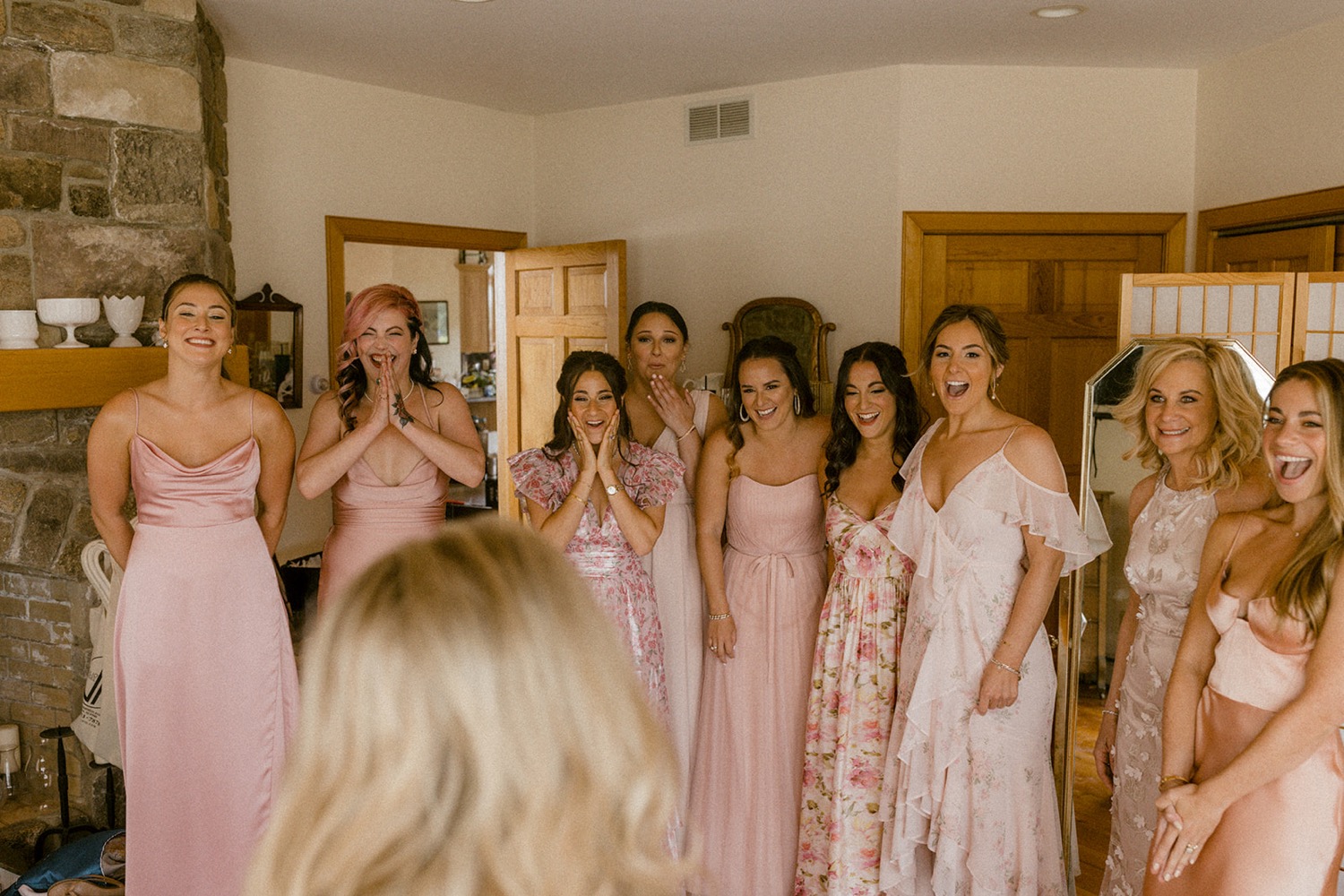 bridesmaids reaction to bride in wedding dress