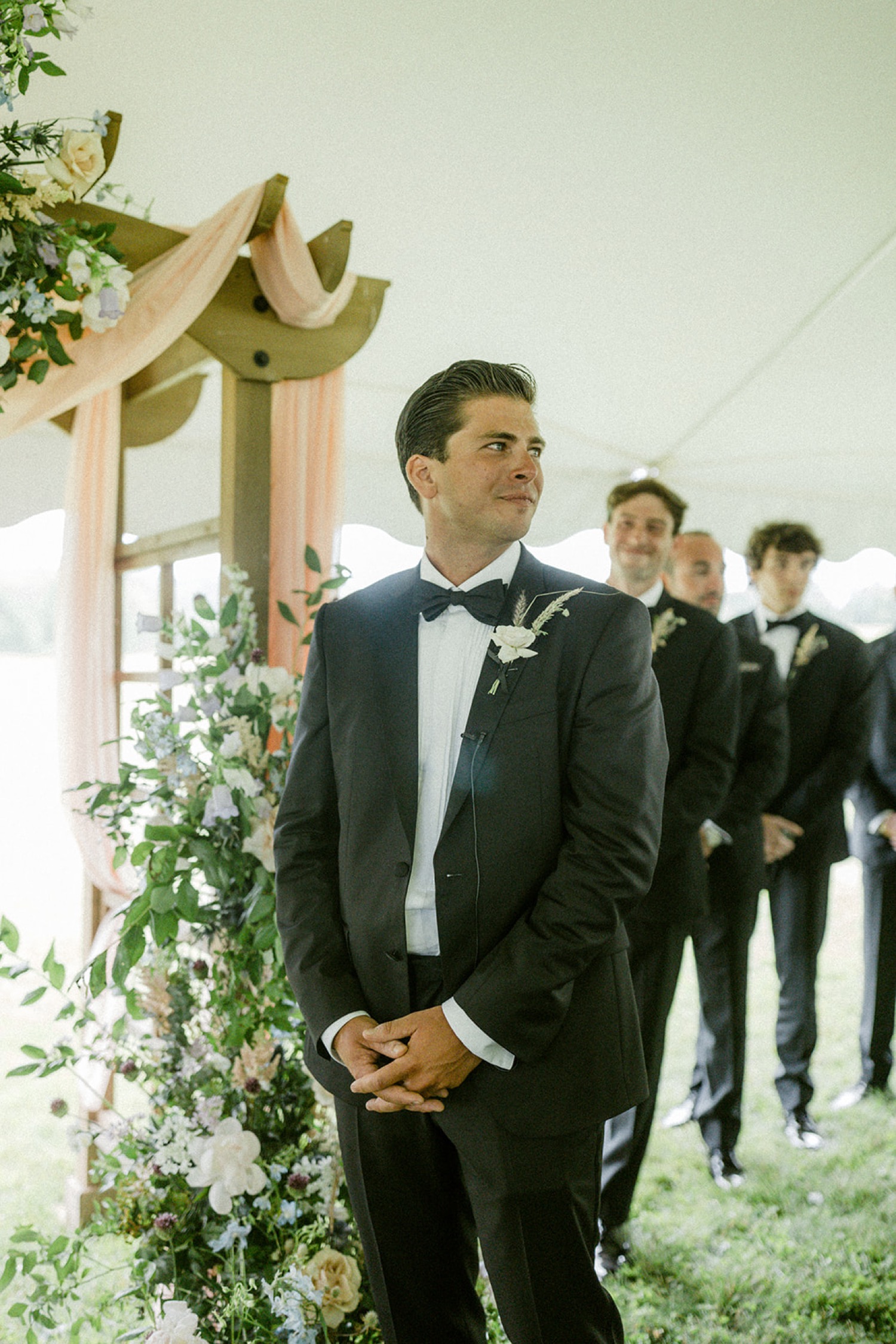 emotional groom looking at bride