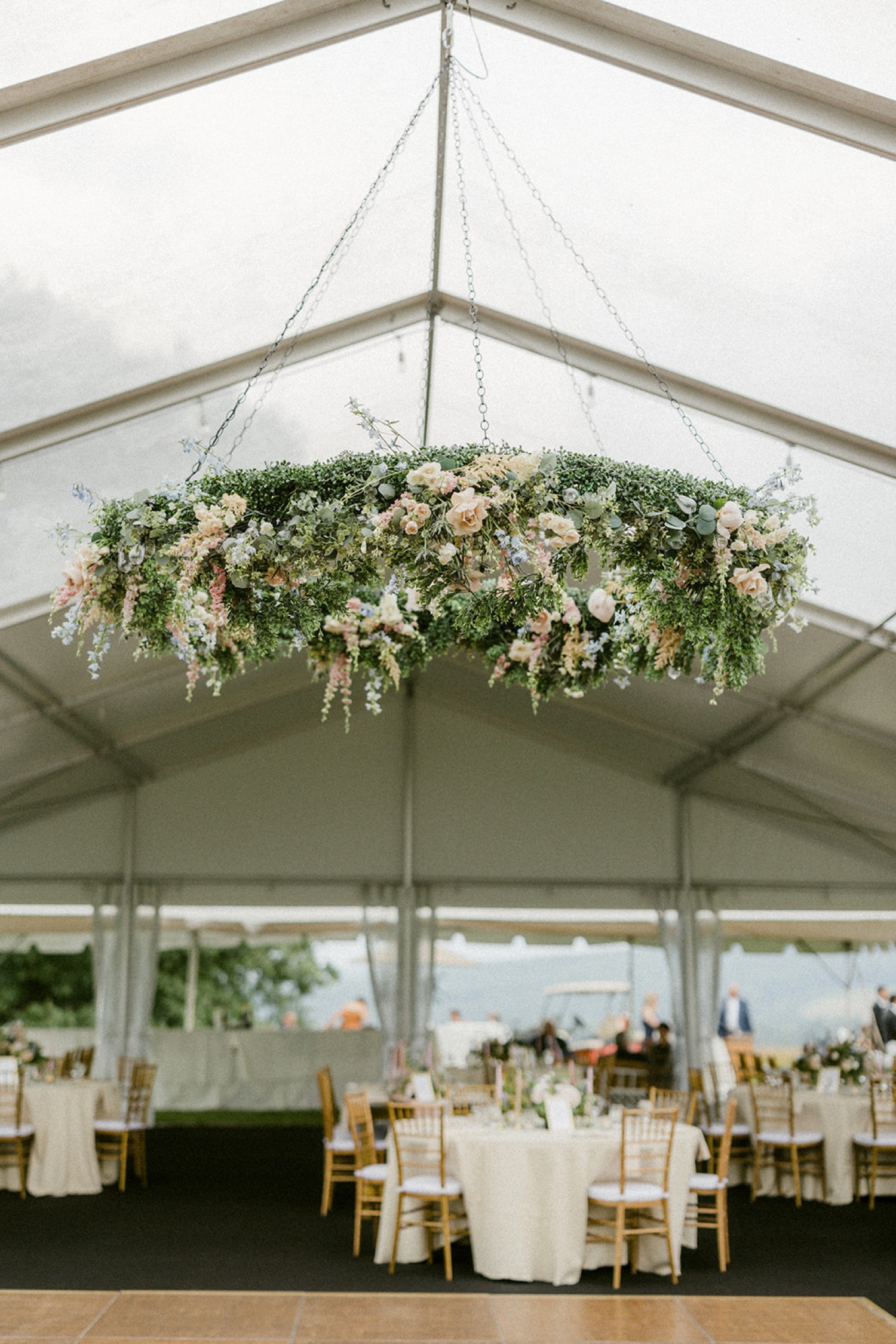 wreath in tent wedding reception