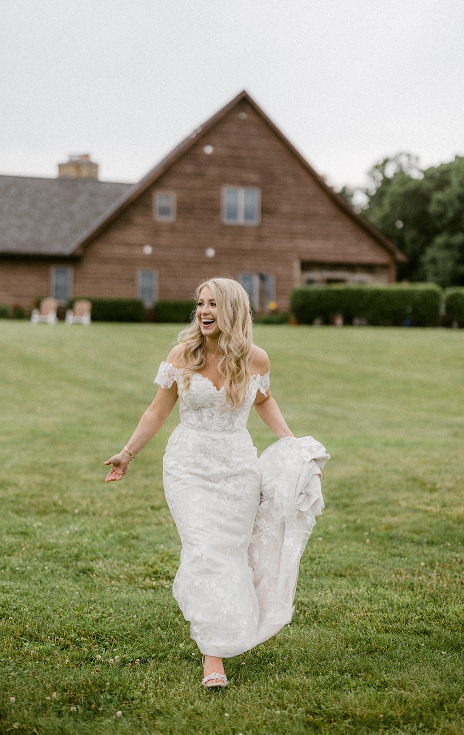 bride in field with farm house