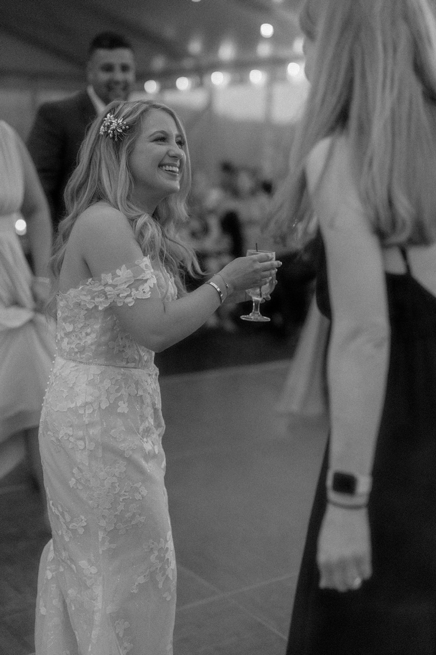 bride smiling with cocktail wedding reception