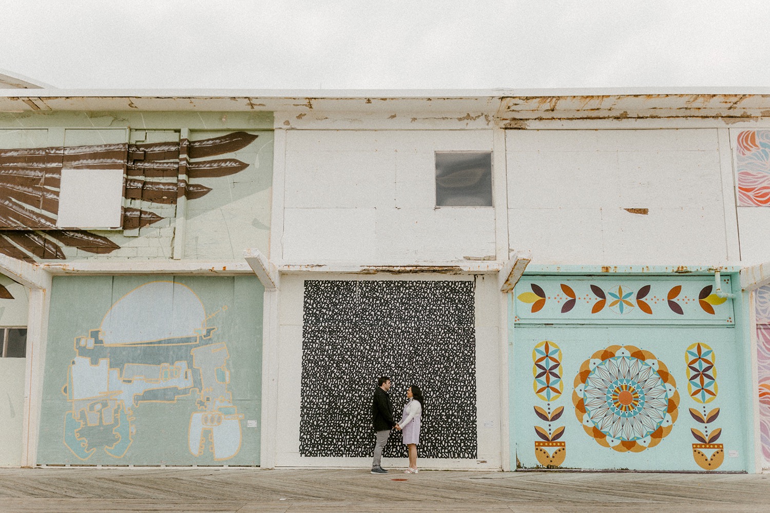 couple holding hands asbury park boardwalk murals