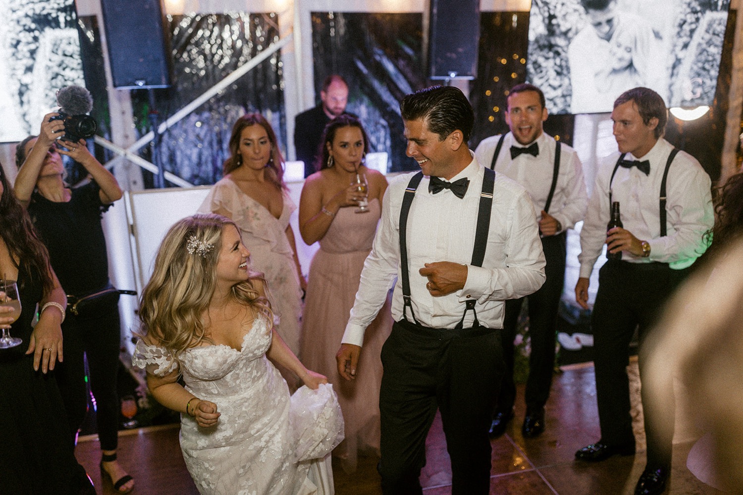 couple dancing fun at wedding reception